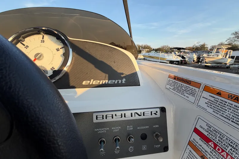 Slide: The Image of 2019 Bayliner Element E16 dashboard with speedometer and control panel. - 22