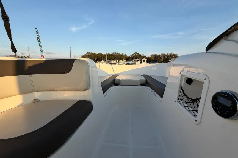 Slide: The Image of 2019 Bayliner Element E16 boat interior with seating and storage compartments. - 28