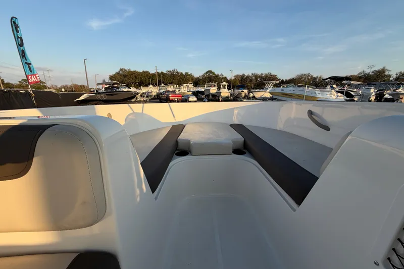 Slide: The Image of 2019 Bayliner Element E16 boat interior with seating, displayed at a boat sale event. - 29