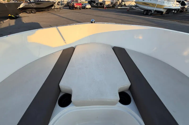 Slide: The Image of 2019 Bayliner Element E16 boat interior with cushioned seating and cup holders. - 34