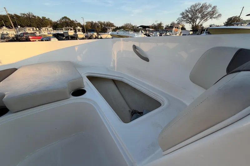 Slide: The Image of 2019 Bayliner Element E16 boat interior with open storage compartment. - 35