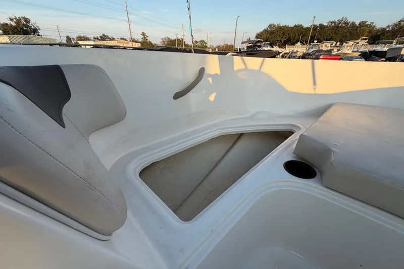 Slide: The Image of 2019 Bayliner Element E16 boat interior with seating and storage compartment. - 36