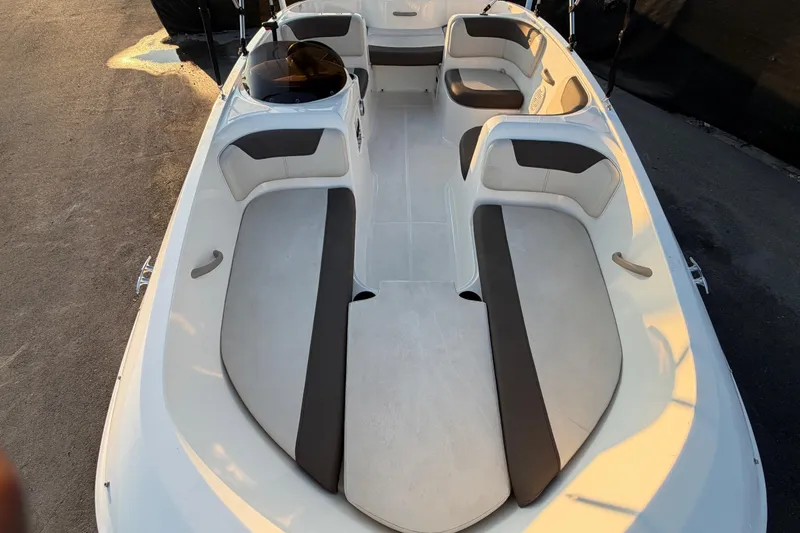 Slide: The Image of 2019 Bayliner Element E16 boat interior with spacious seating and modern design. - 39