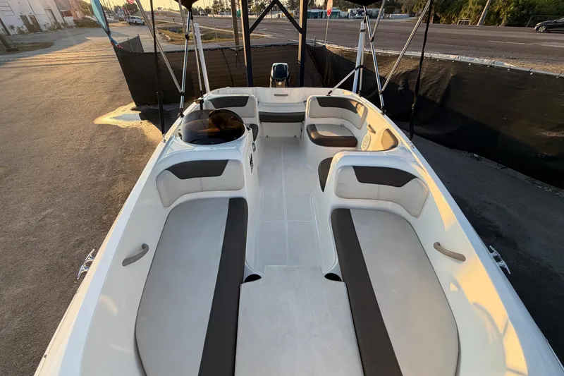 Slide: The Image of 2019 Bayliner Element E16 boat interior with spacious seating and modern design. - 55