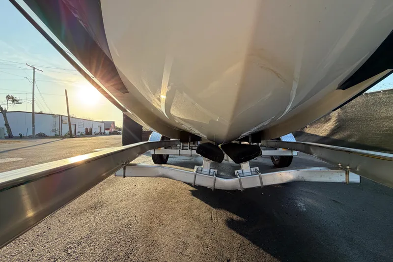 Slide: The Image of 2019 Bayliner Element E16 boat on trailer, sunset background. - 57