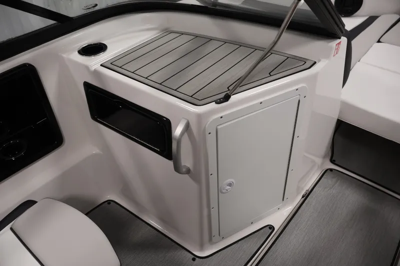 Slide: The Image of 2026 Yamaha Boats SX195 interior with sleek storage compartment and modern design. - 35