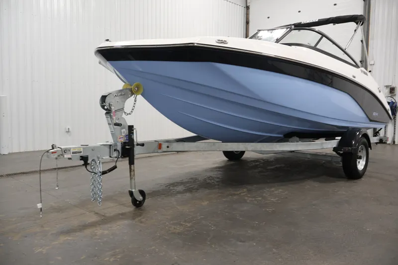 Slide: The Image of 2026 Yamaha Boats SX195 on trailer in indoor showroom setting. - 47