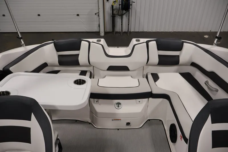 Slide: The Image of 2026 Yamaha Boats SX195 interior with sleek seating and integrated table. - 39
