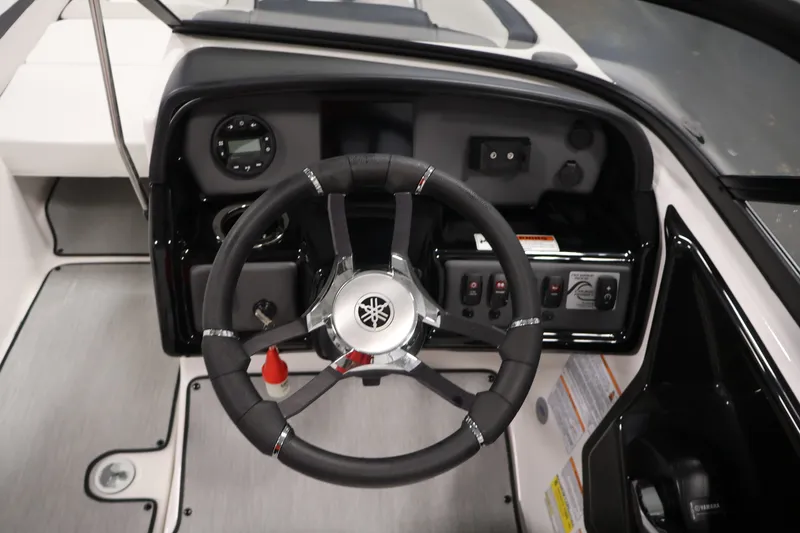 Slide: The Image of 2026 Yamaha Boats SX195 steering console with modern controls and sleek design. - 22