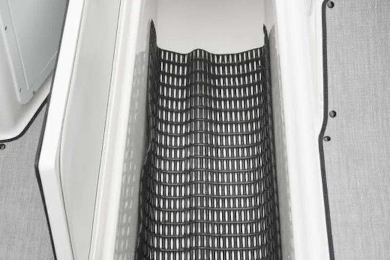 Slide: The Image of Storage compartment of 2026 Yamaha Boats SX195 with black mesh lining. - 5