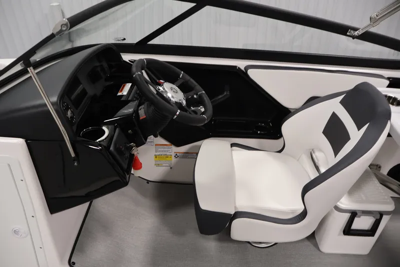 Slide: The Image of 2026 Yamaha Boats SX195 cockpit with sleek steering wheel and modern seating design. - 21