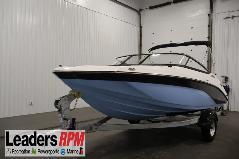 The Image of 2026 Yamaha Boats SX195 in showroom, displayed on trailer. - 0