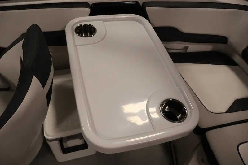 Slide: The Image of 2026 Yamaha Boats SX195 interior with sleek seating and integrated cup holders. - 41