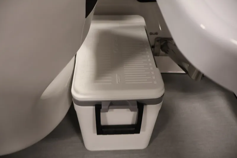 Slide: The Image of White cooler stored under seat in 2026 Yamaha Boats SX195. - 40