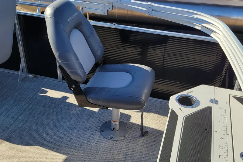 Slide: The Image of 2020 Crestliner 200 Rally DX CS boat seat with gray upholstery and cup holder. - 6