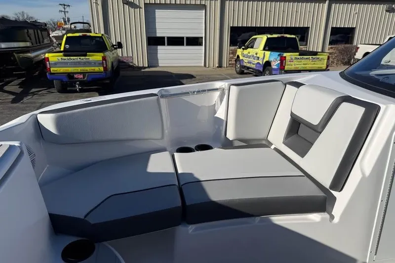 Slide: The Image of 2026 Yamaha Boats AR220 interior seating with modern design and cup holders. - 13