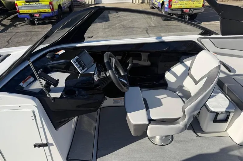 Slide: The Image of 2026 Yamaha Boats AR220 cockpit with modern steering and comfortable seating. - 8