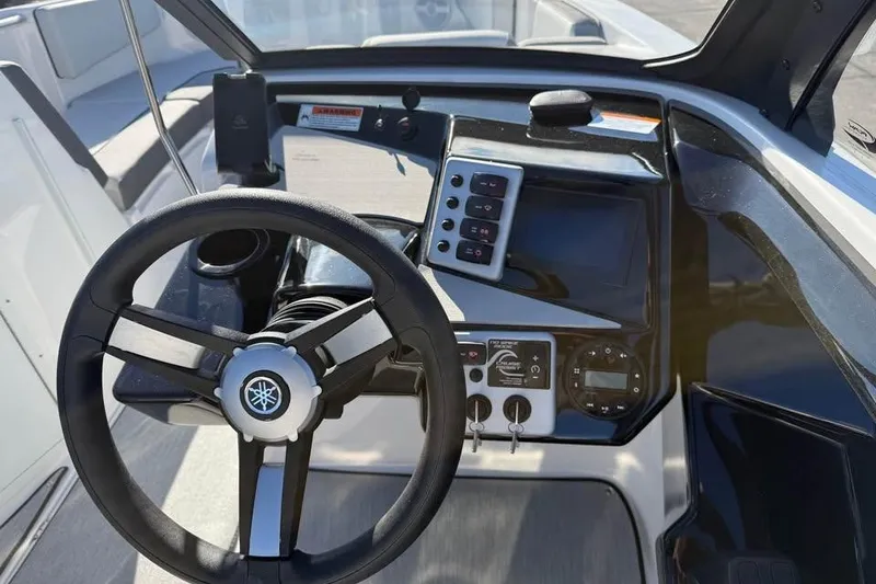 Slide: The Image of 2026 Yamaha Boats AR220 dashboard with steering wheel and control panel. - 9
