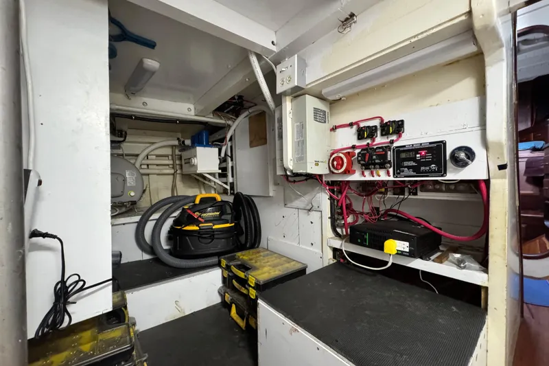 Slide: The Image of Electrical control room of a 1918 Peterson Tugboat, featuring wiring and equipment. - 16