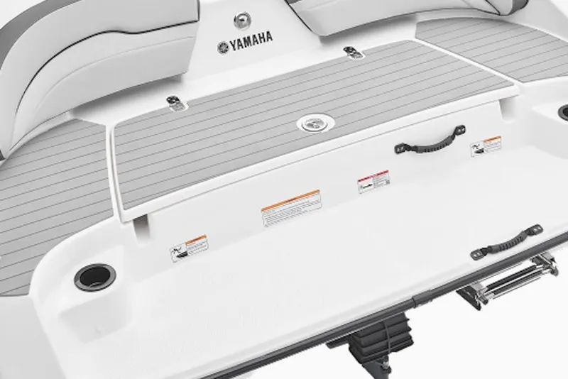 Slide: The Image of 2014 Yamaha Boats SX190 swim platform with gray decking and integrated handles. - 4