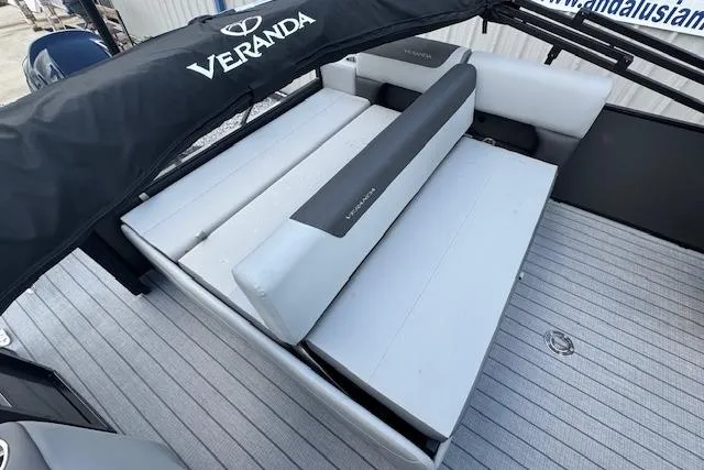 Slide: The Image of 2026 Veranda Relax VR22VLC boat interior with cushioned seating and branded canopy. - 9