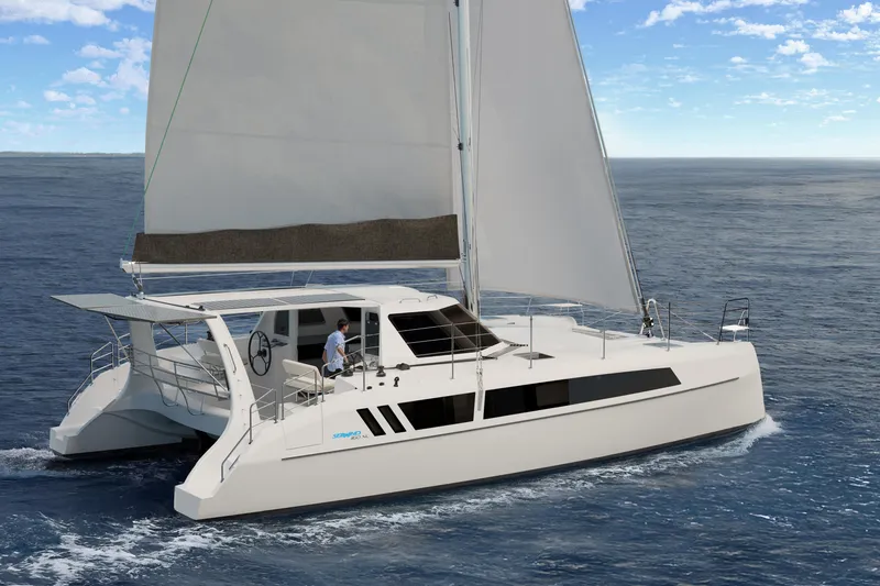 Slide: The Image of 2026 Seawind 1160XL catamaran sailing on open ocean under clear skies. - 10