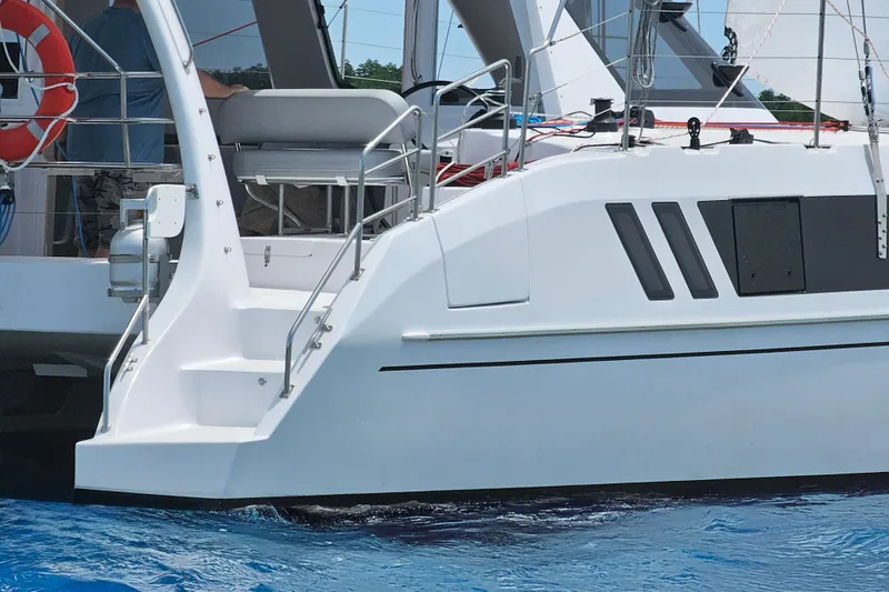 Slide: The Image of 2026 Seawind 1160XL catamaran, featuring sleek design and modern amenities, on blue water. - 4