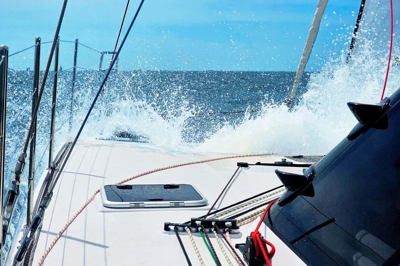 Slide: The Image of 2026 Seawind 1160XL sailing through ocean waves, vibrant blue sky. - 9