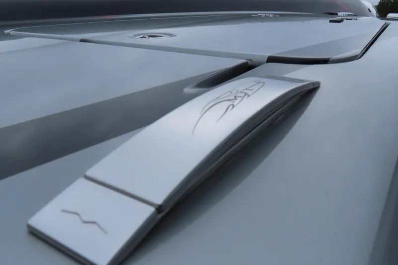 Slide: The Image of Close-up of 2025 MTI 390X sleek metallic surface with engraved design. - 10