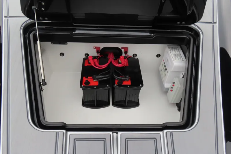 Slide: The Image of Battery compartment of 2025 MTI 390X boat with red and black wiring. - 12