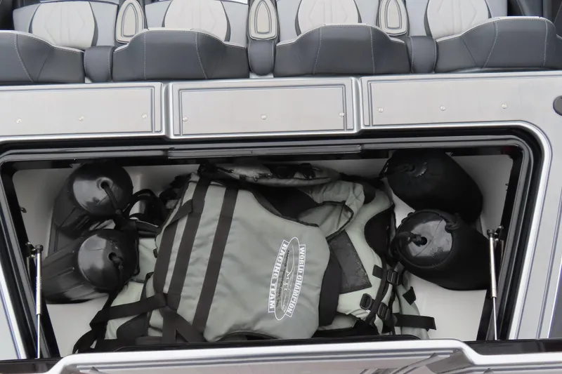 Slide: The Image of Storage compartment in 2025 MTI 390X boat with life jackets and fenders. - 15