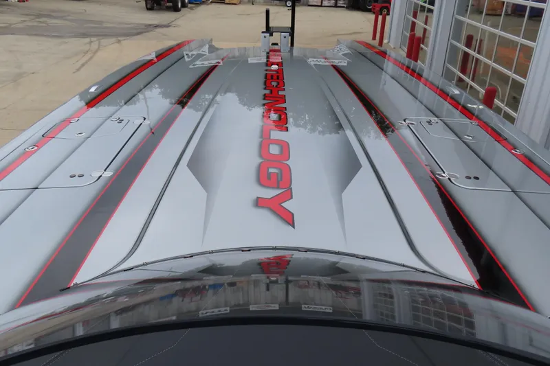 Slide: The Image of 2025 MTI 390X powerboat with sleek design and bold "TECHNOLOGY" branding. - 17