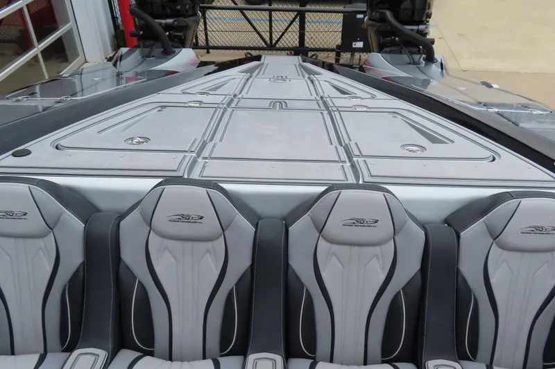 Slide: The Image of 2025 MTI 390X boat interior with sleek gray seating and modern design. - 18