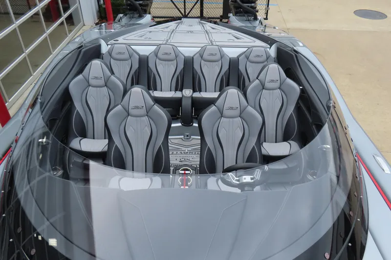 Slide: The Image of 2025 MTI 390X boat interior with sleek gray seating and modern design. - 23