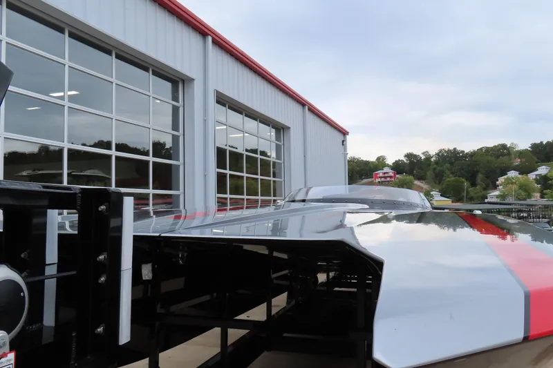 Slide: The Image of 2025 MTI 390X boat outside a modern garage with glass doors. - 5
