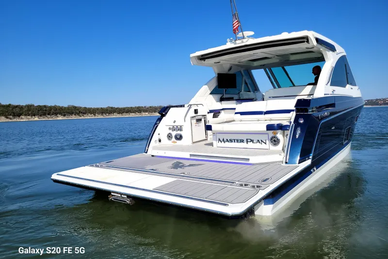 Slide: The Image of 2023 Formula 380 Super Sport Crossover I/O on calm water, rear view. - 12