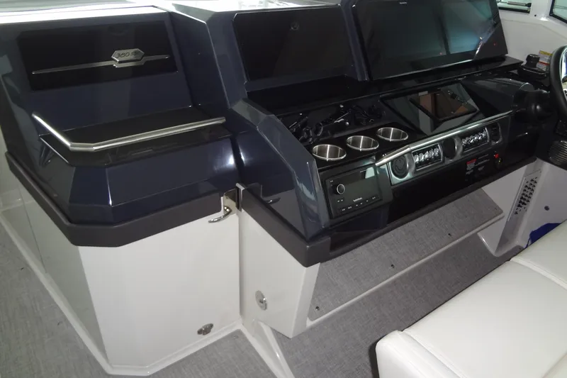 Slide: The Image of 2023 Formula 380 Super Sport Crossover I/O helm with advanced controls and displays. - 36