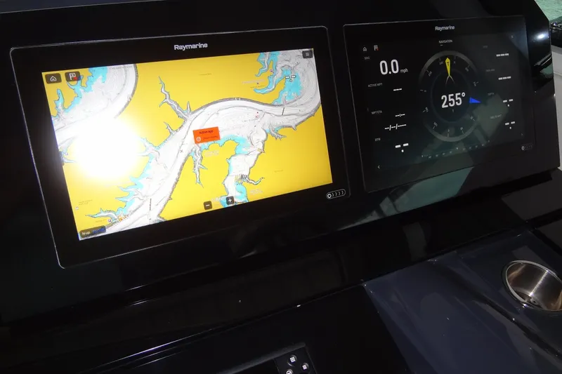 Slide: The Image of Dashboard of 2023 Formula 380 Super Sport Crossover with Raymarine navigation displays. - 37