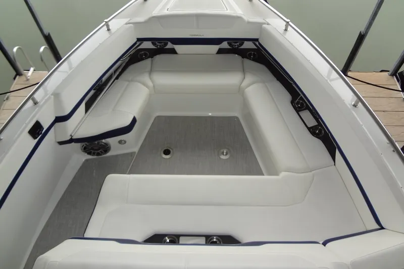 Slide: The Image of 2023 Formula 380 Super Sport Crossover I/O boat interior with white seating and modern design. - 43