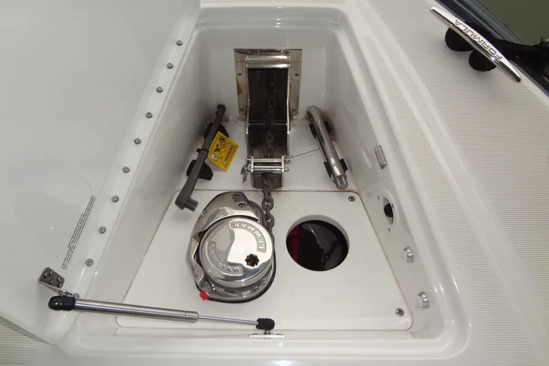 Slide: The Image of 2023 Formula 380 Super Sport Crossover I/O interior with modern seating and table. - 50