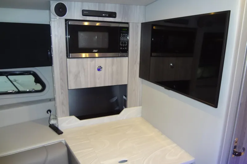 Slide: The Image of Cozy cabin bed in 2023 Formula 380 Super Sport Crossover I/O boat. - 55