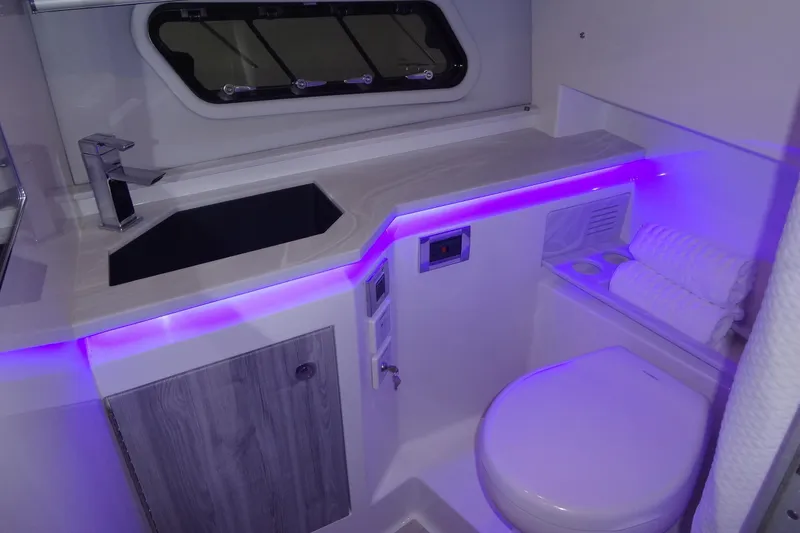 Slide: The Image of Shower area in 2023 Formula 380 Super Sport Crossover I/O boat, featuring modern fixtures. - 60