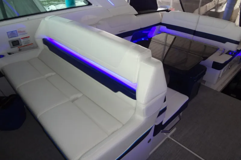 Slide: The Image of 2023 Formula 380 Super Sport Crossover I/O interior with illuminated seating and cup holders. - 62