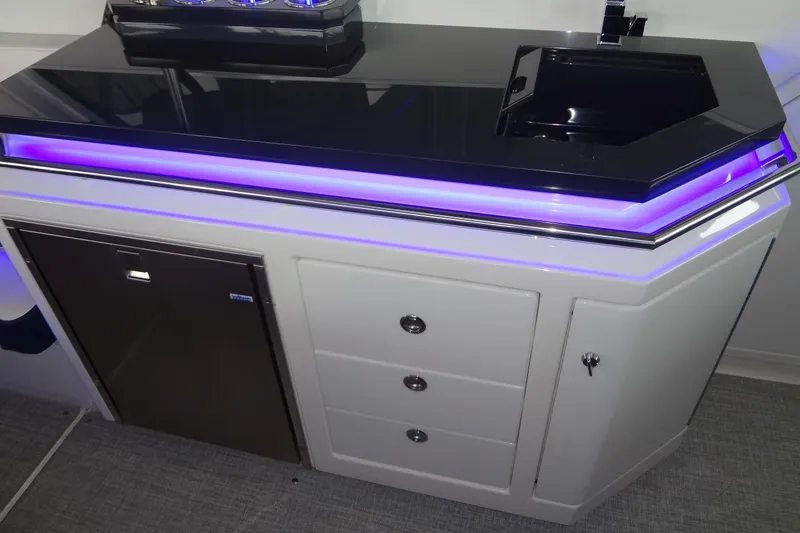 Slide: The Image of 2023 Formula 380 Super Sport Crossover I/O interior with sleek seating and ambient lighting. - 64