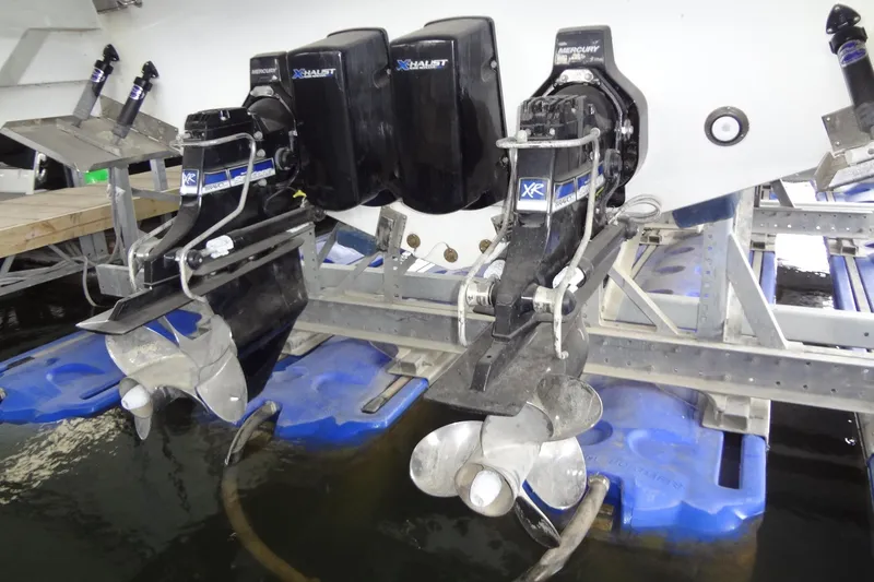 Slide: The Image of 2023 Formula 380 Super Sport Crossover I/O boat engines and propellers in water. - 75