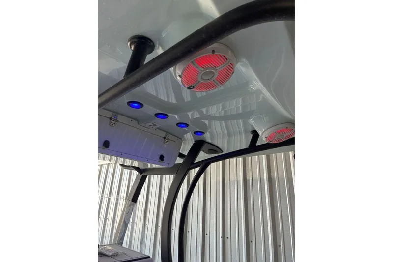 Slide: The Image of 2023 Xplor X24 boat interior with blue and red LED lights, sleek design. - 16