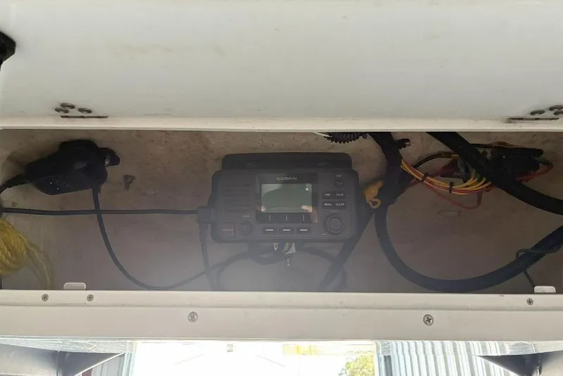 Slide: The Image of Interior view of 2023 Xplor X24 with mounted Garmin device and wiring. - 18