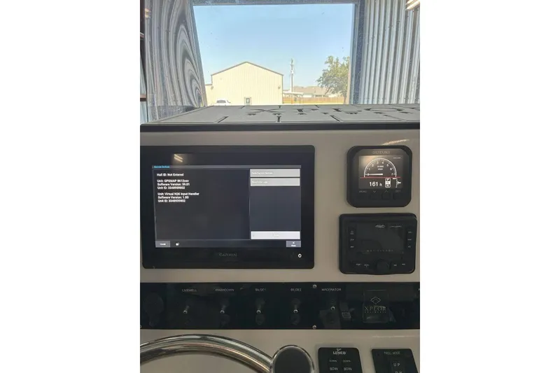Slide: The Image of 2023 Xplor X24 dashboard with Garmin display and Suzuki gauge. - 20