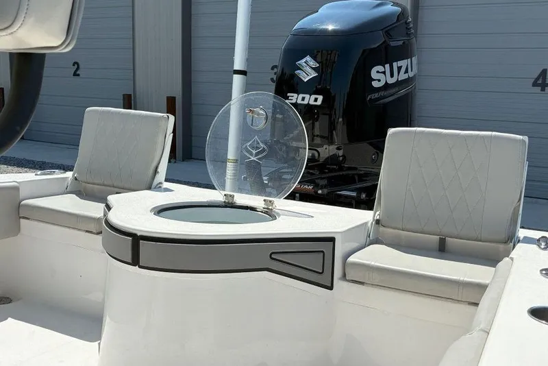 Slide: The Image of 2023 Xplor X24 boat interior with Suzuki 300 engine, featuring seating and storage. - 21