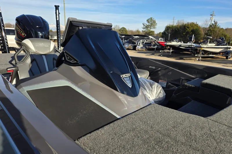 Slide: The Image of 2026 Skeeter ZXE21 boat with sleek design and modern features, displayed outdoors. - 35
